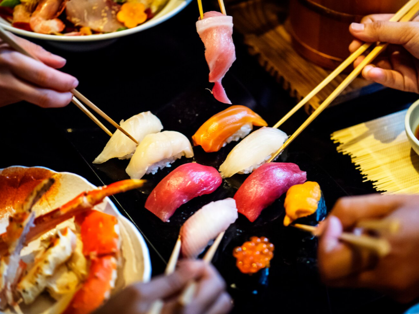 A high-end sushi restaurant in Singapore being enjoyed by individuals.