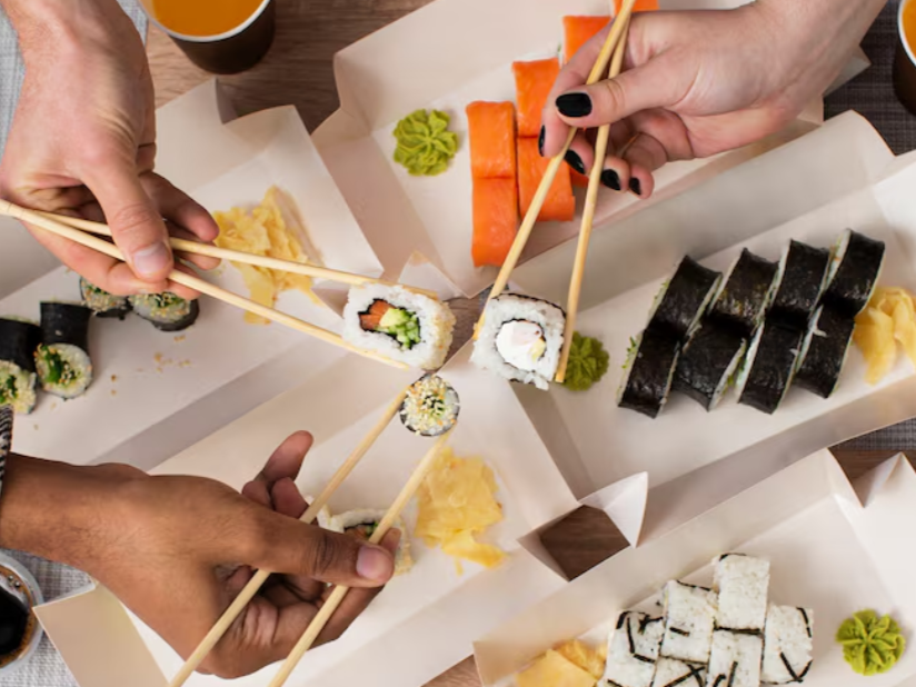 A group of friends enjoying the famous Japanese delicacy.