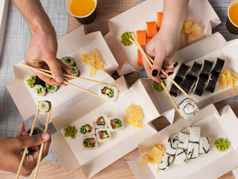 Three people eating sushi, showcasing that sushi "is" for everyone.