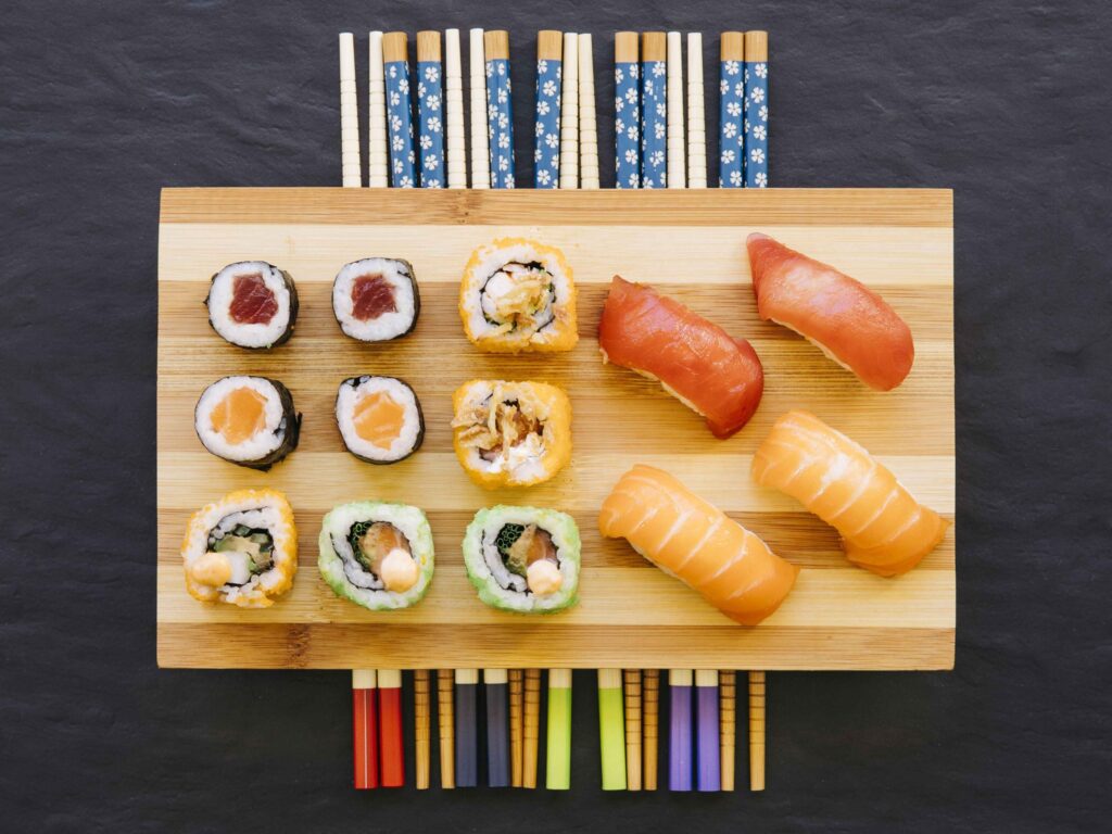 A platter of sushi full of different flavors with each dish.