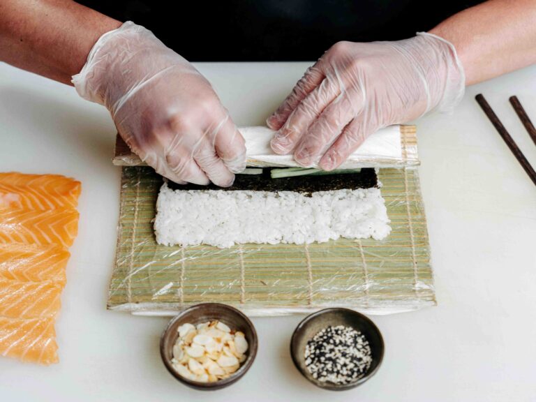 A shot of a chef rolling the Japanese delicacy called sushi.