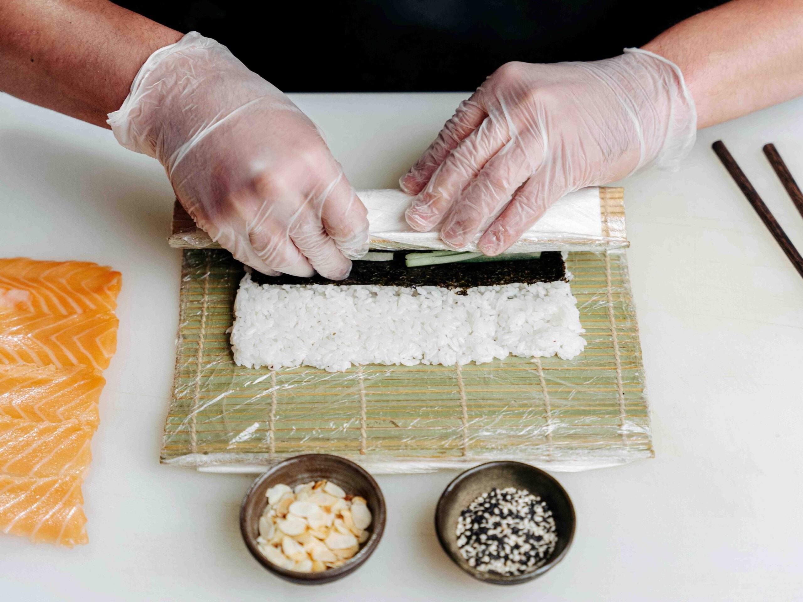 A shot of a chef rolling the Japanese delicacy called sushi.