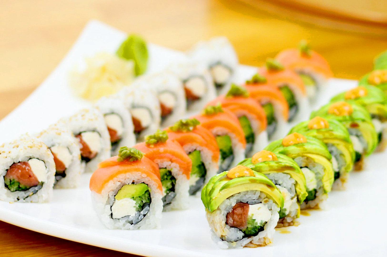 Assorted homemade sushi rolls with salmon and avocado