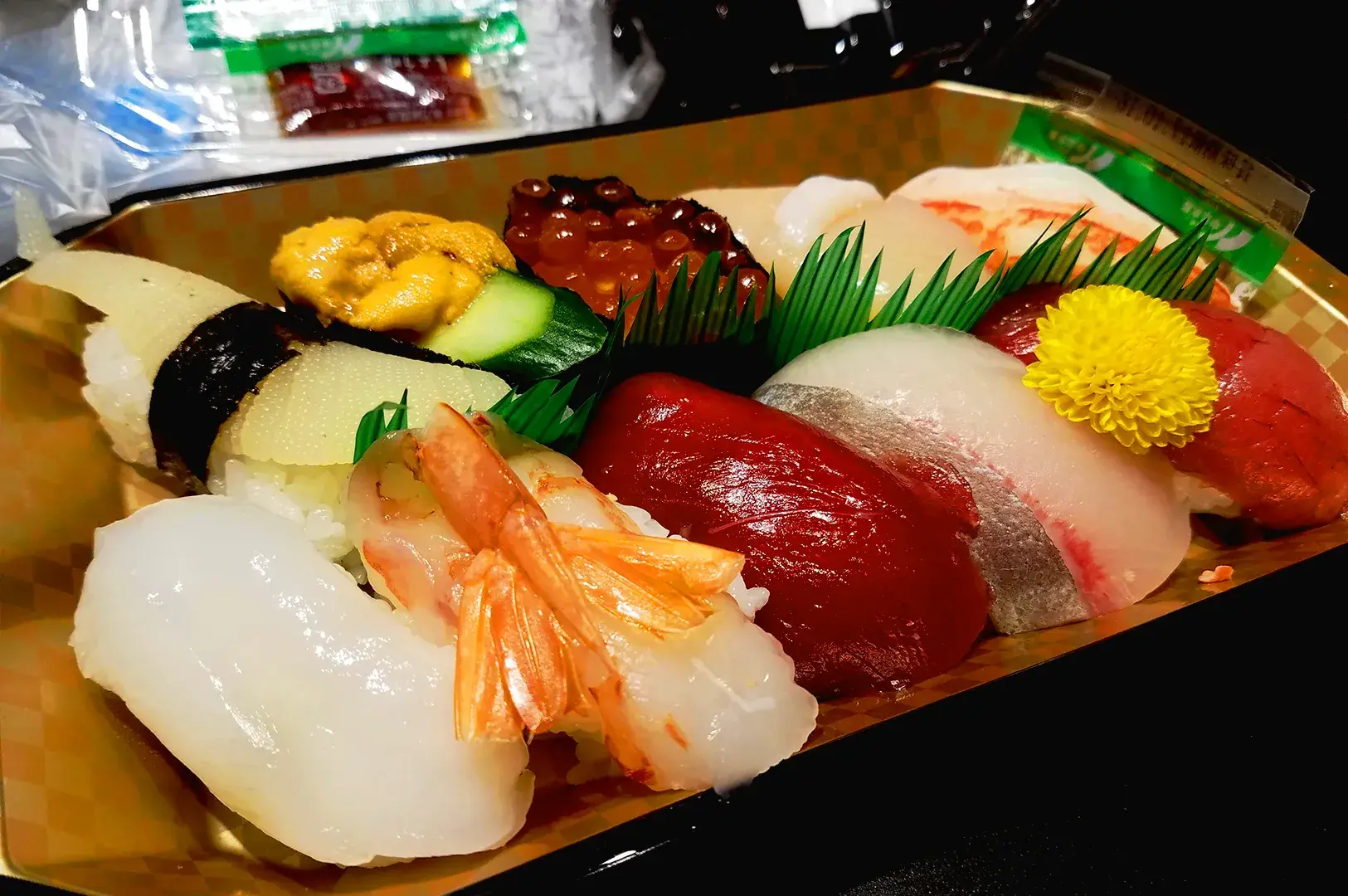 Premium Japanese sushi platter featuring tuna, scallop, ikura, uni, and shrimp nigiri served fresh in Singapore Japanese food market