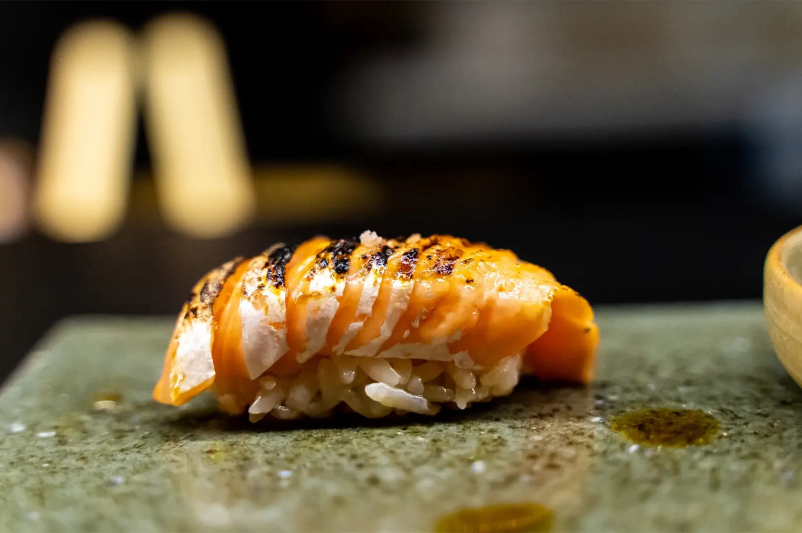 Torched sushi with charred marks
