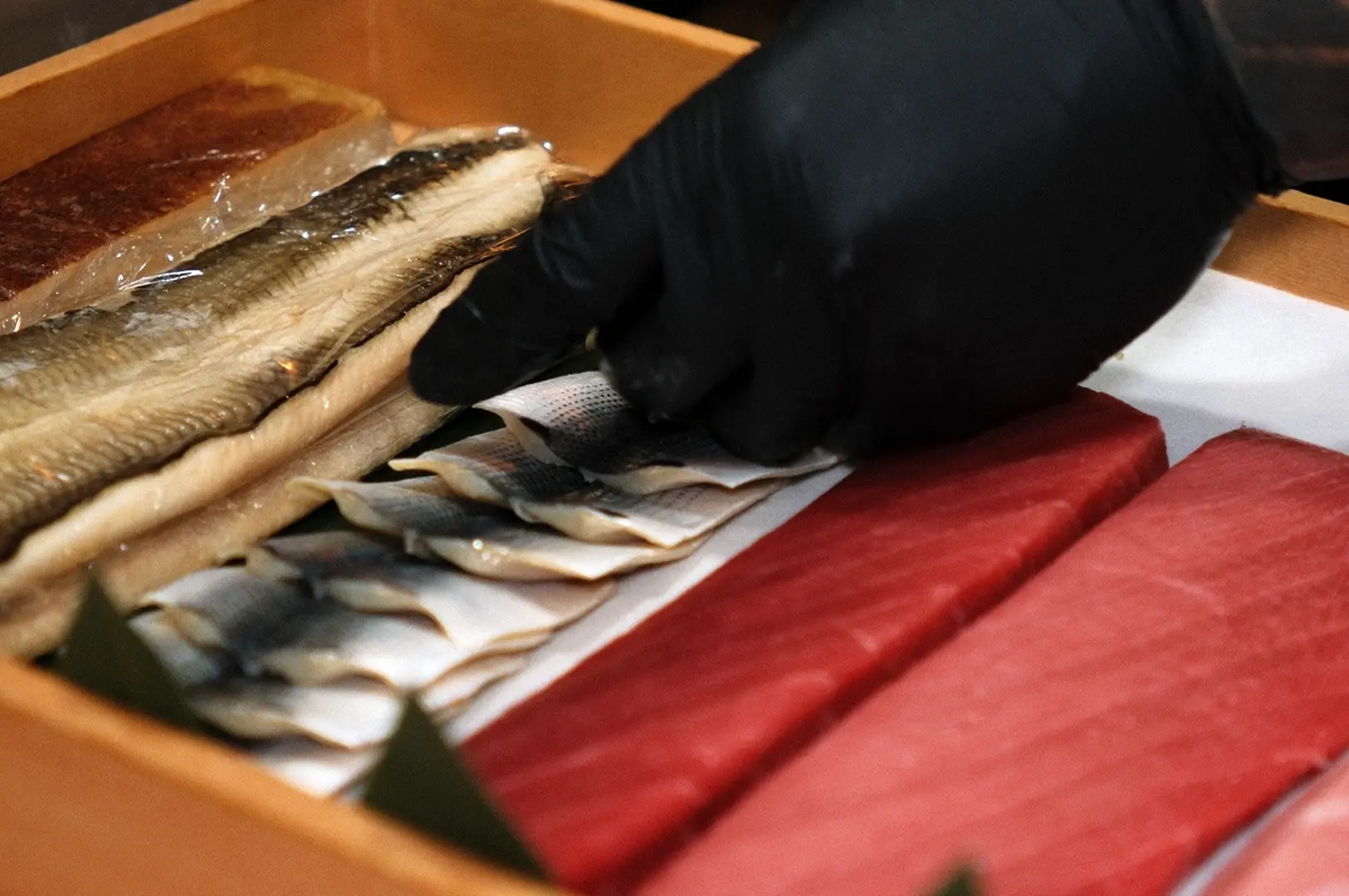 Fresh fish and tuna in wooden box