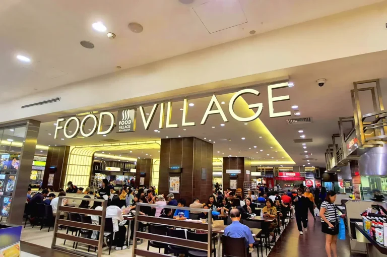 Food Village at Takashimaya Singapore crowded with diners enjoying Japanese food and Asian cuisine in a modern food hall setting along Orchard Road