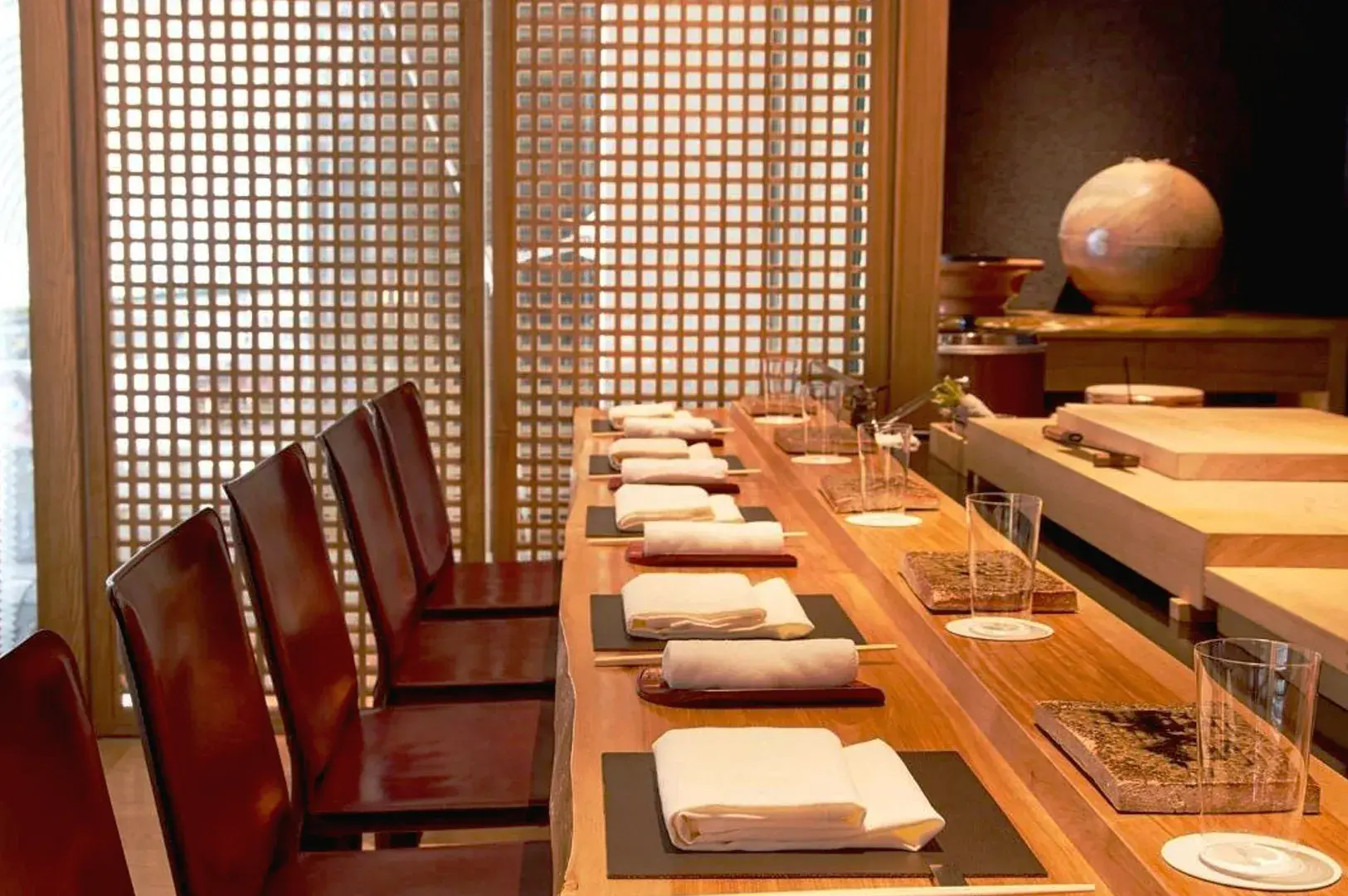 Elegant omakase sushi bar in Singapore with minimalist Japanese design, showcasing premium sushi dining and traditional counter experience