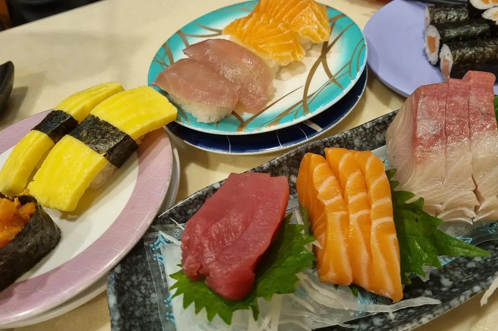 Sashimi plates on conveyor belt